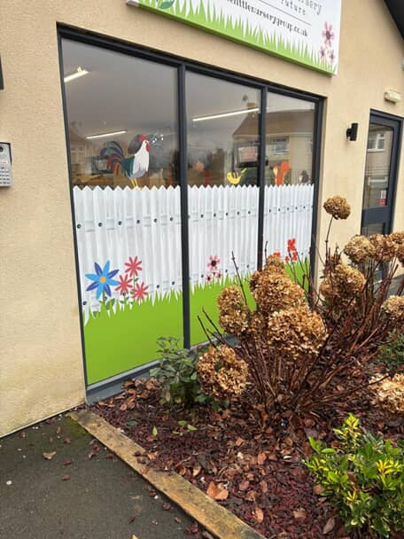 An image of window graphics for a nursery.
